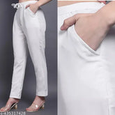 White cotton women's trousers with side pocket, drawstring, and elastic for comfort. Made in India